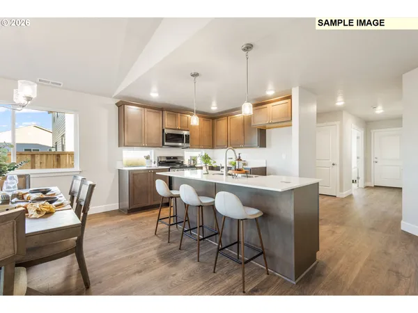a open kitchen with stainless steel appliances kitchen island granite countertop a sink and cabinets