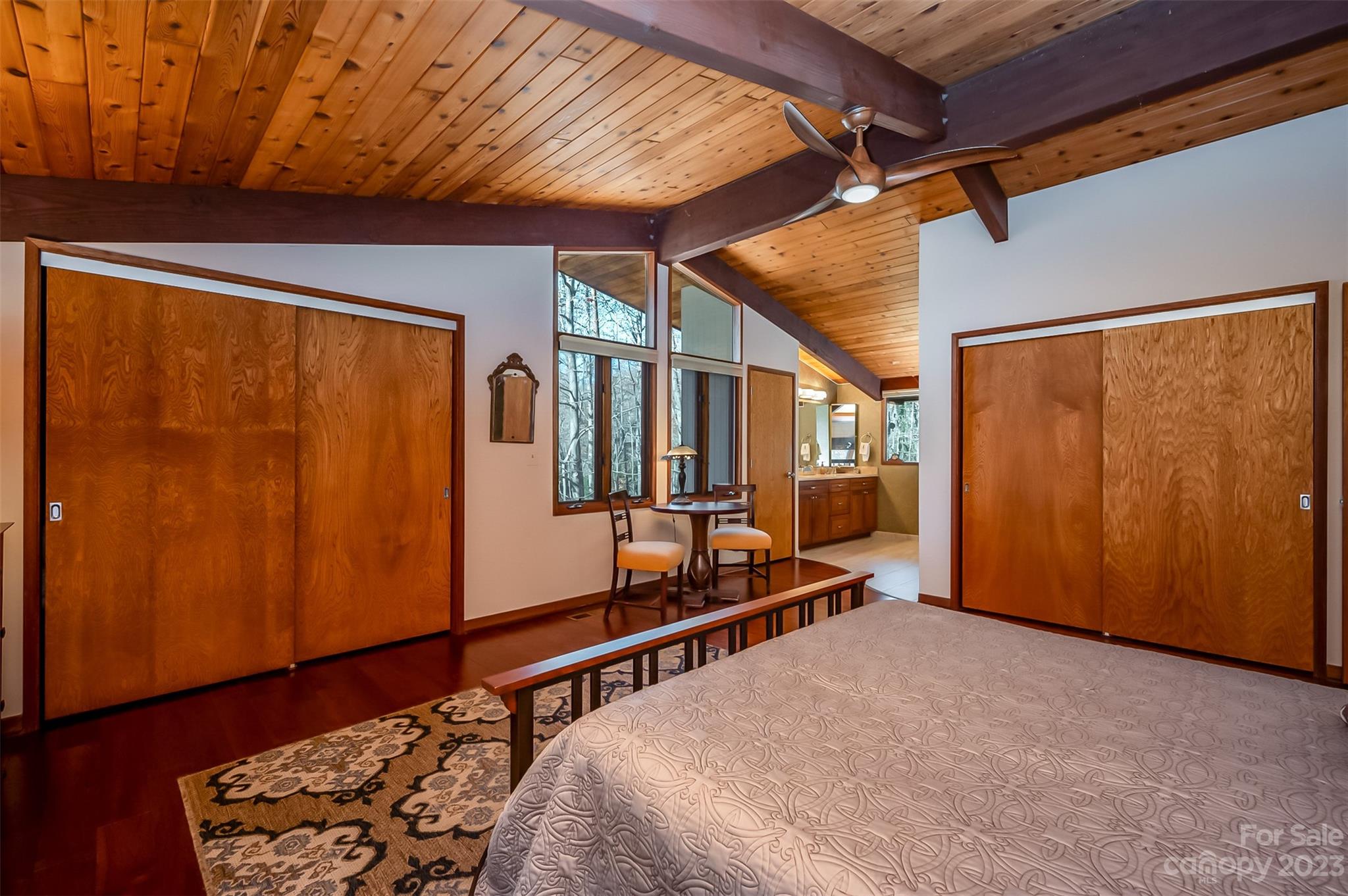 548 Howard Gap Road Tryon, NC 28782 - Photo 24 of 48 a bed room with a bed and wooden floor