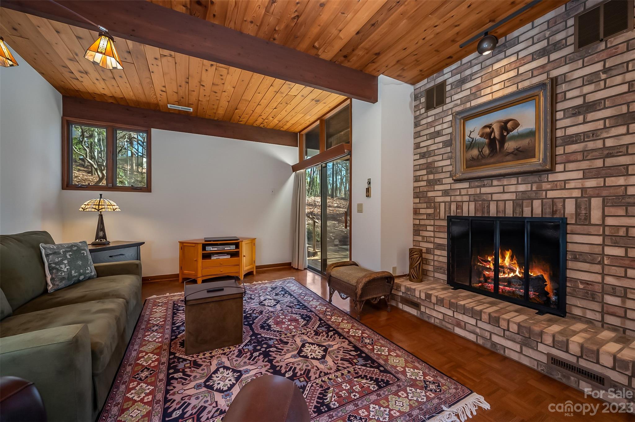 548 Howard Gap Road Tryon, NC 28782 - Photo 30 of 48 a living room with furniture and a fireplace