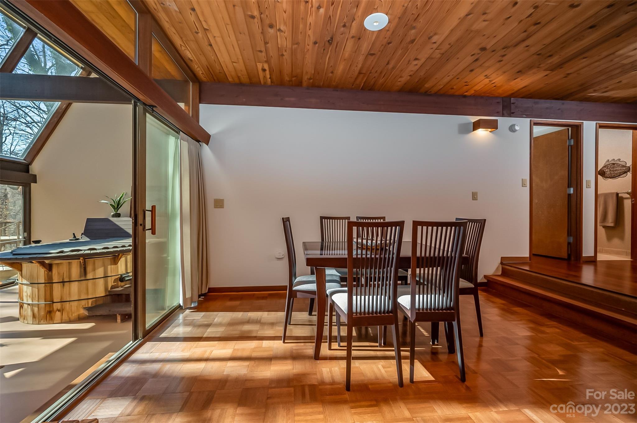 548 Howard Gap Road Tryon, NC 28782 - Photo 32 of 48 a view of a dining room with furniture window and wooden floor