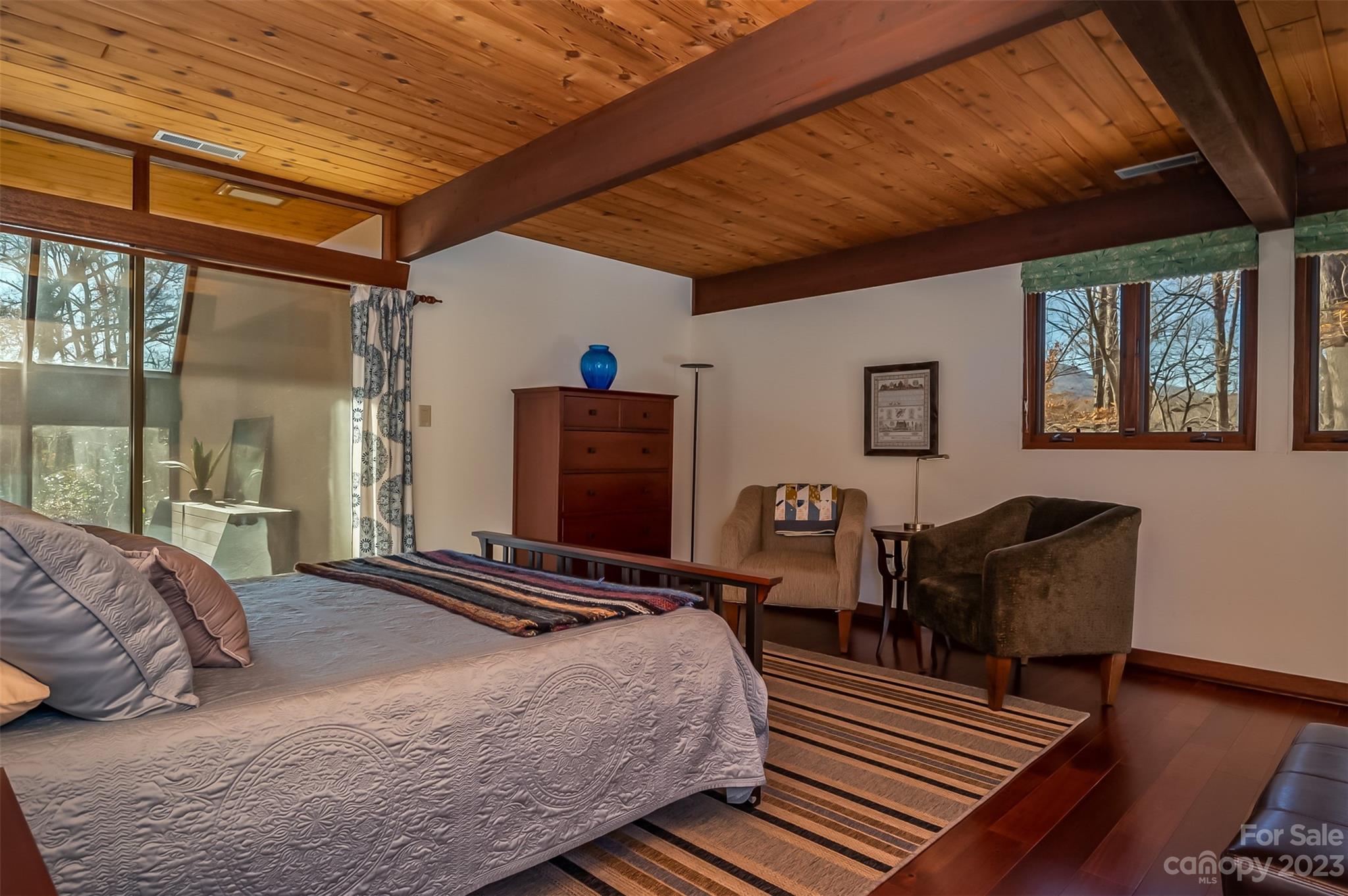 548 Howard Gap Road Tryon, NC 28782 - Photo 35 of 48 a bedroom with bed and wooden floor