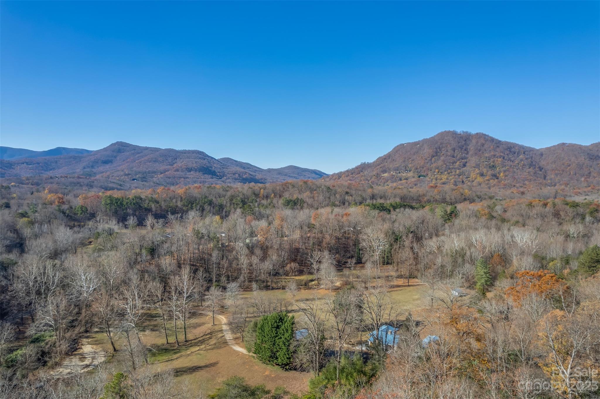 548 Howard Gap Road Tryon, NC 28782 - Photo 47 of 48 a view of a town with mountains in the background