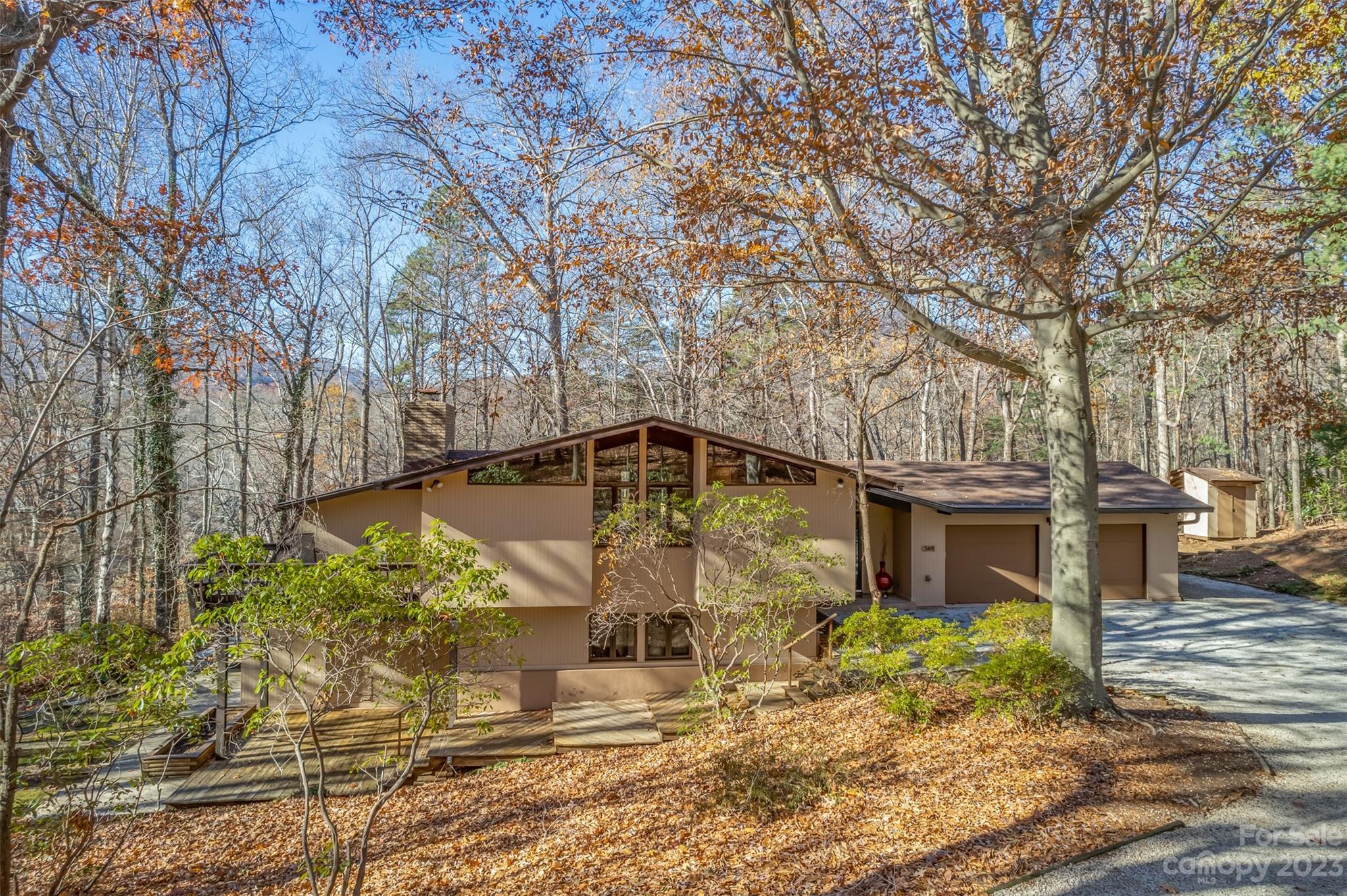 548 Howard Gap Road Tryon, NC 28782 - Photo 6 of 48 a front view of a house with a yard