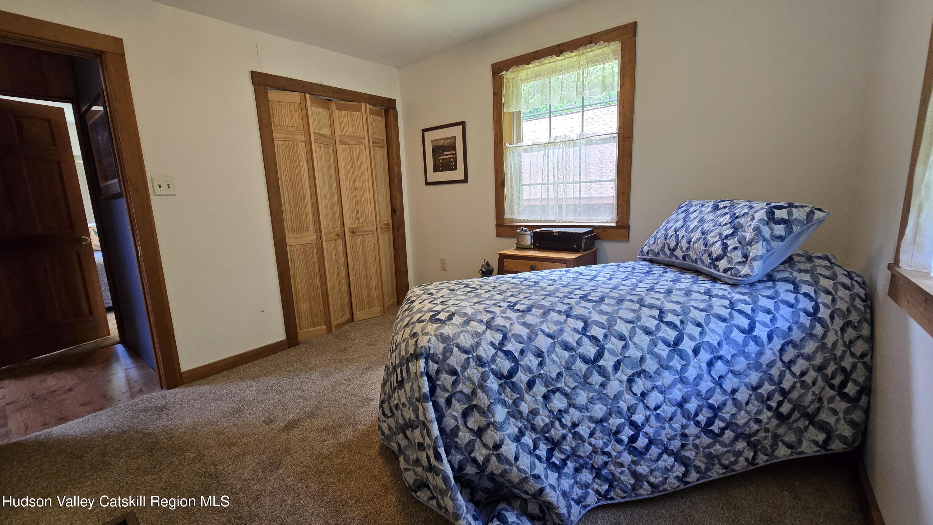 3620 County Rte 9 East Chatham, NY 12060 - Photo 19 of 28 a bedroom with a bed and a window