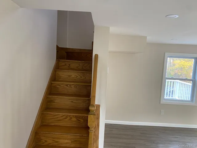 a view of entryway with wooden floor