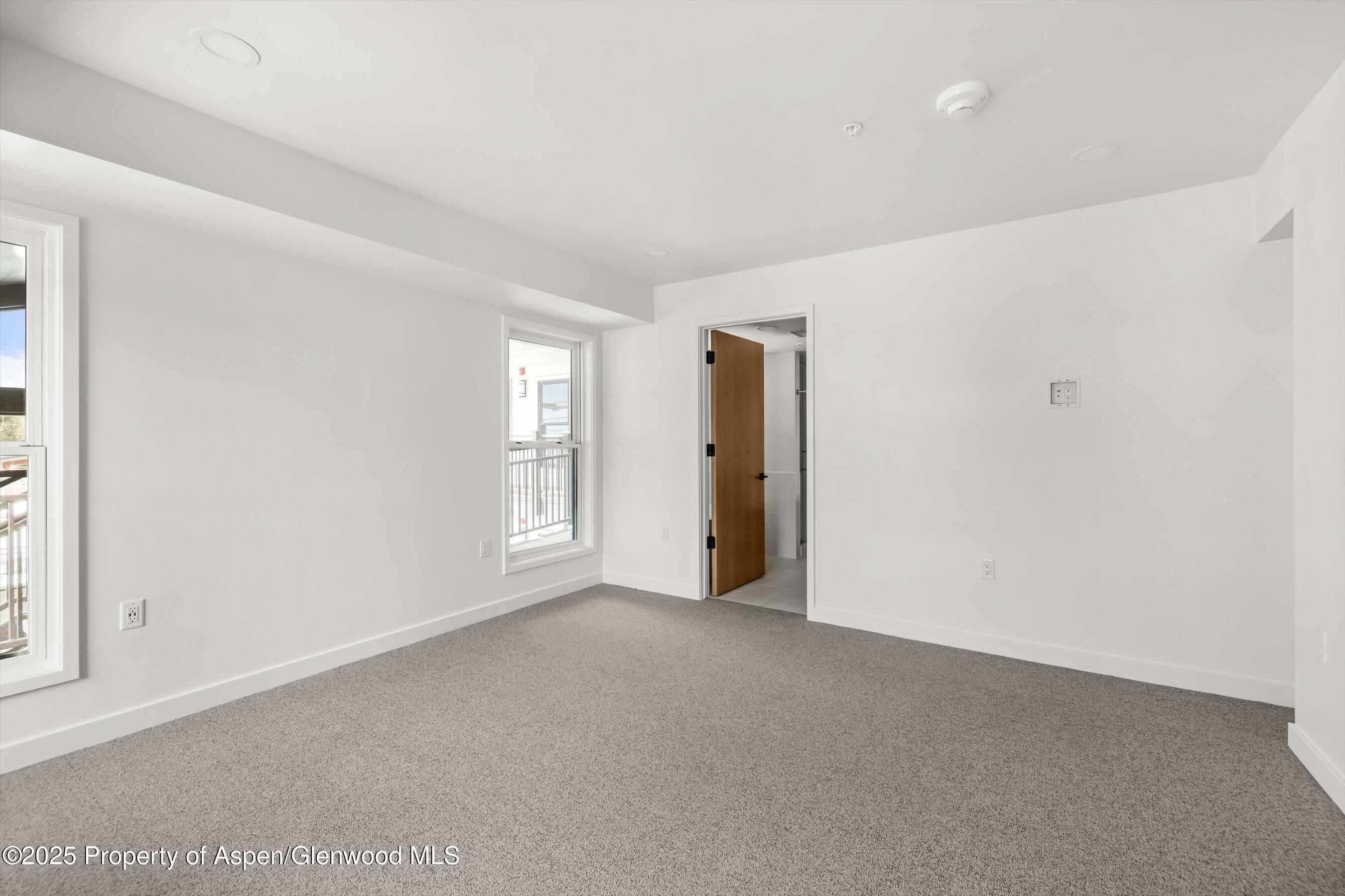 360 Wood Road, Unit 501 Snowmass Village, CO 81615 - Photo 13 of 39 a view of an empty room with a window