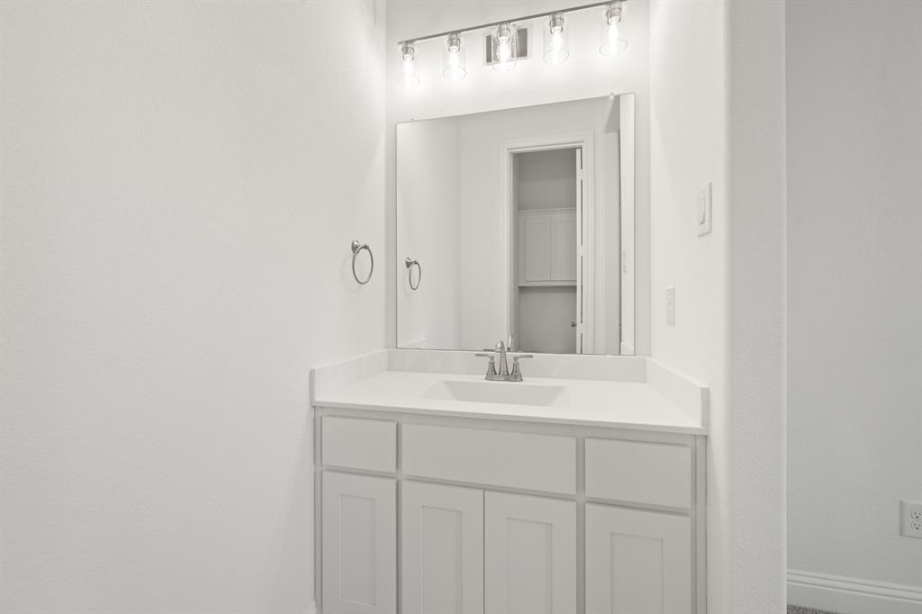 27 Old Crow Road Joshua, TX 76058 - Photo 19 of 35 a bathroom with a sink and a mirror