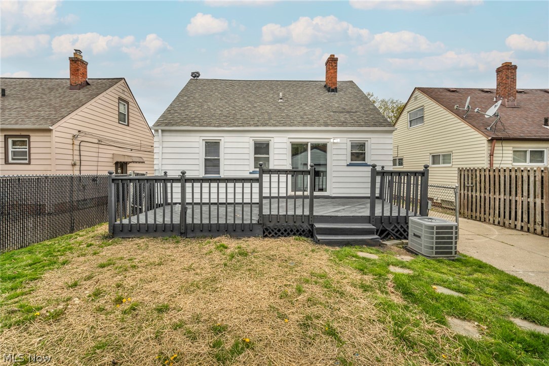 1609 Mapledale Road Wickliffe, OH 44092 - Photo 38 of 46 Rear view of house with a deck, a lawn, and central air condition unit