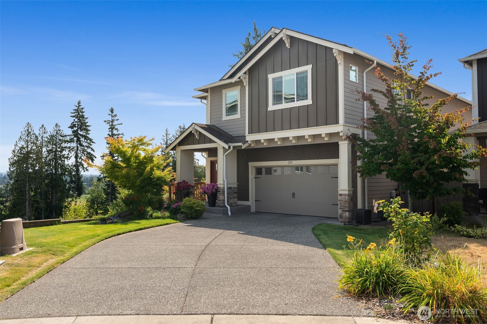 216 178th Street Southeast Bothell, WA 98012 - Photo 4 of 40 a front view of a house with a yard and garage