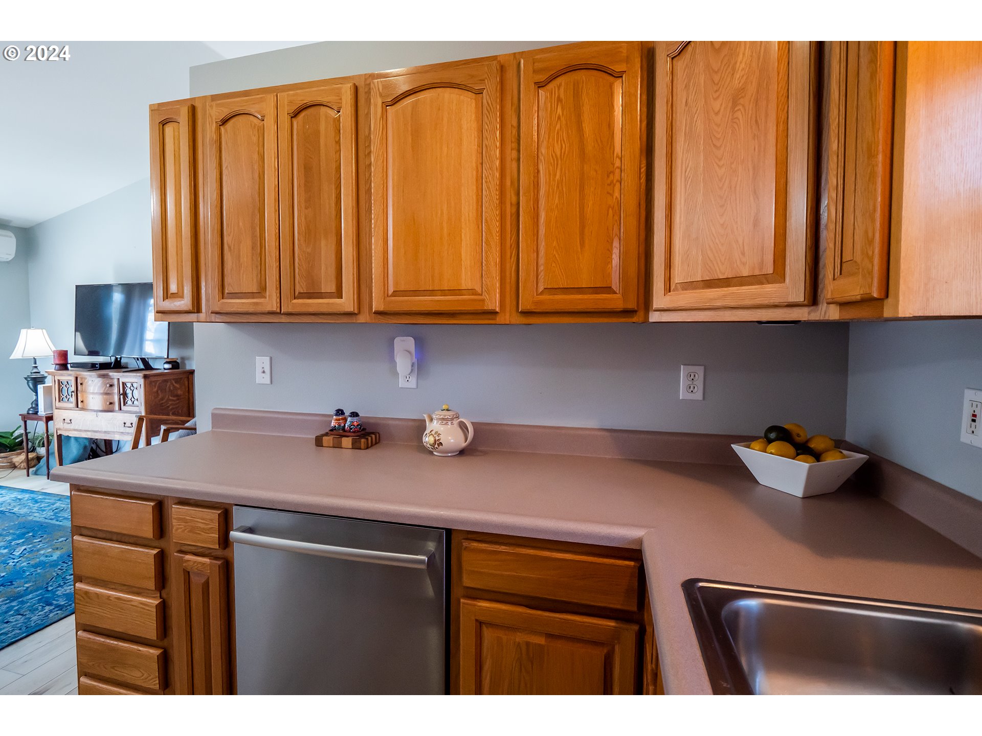 693 Hanover Street Eugene, OR 97402 - Photo 13 of 32 a kitchen with stainless steel appliances granite countertop a sink dishwasher stove and cabinets