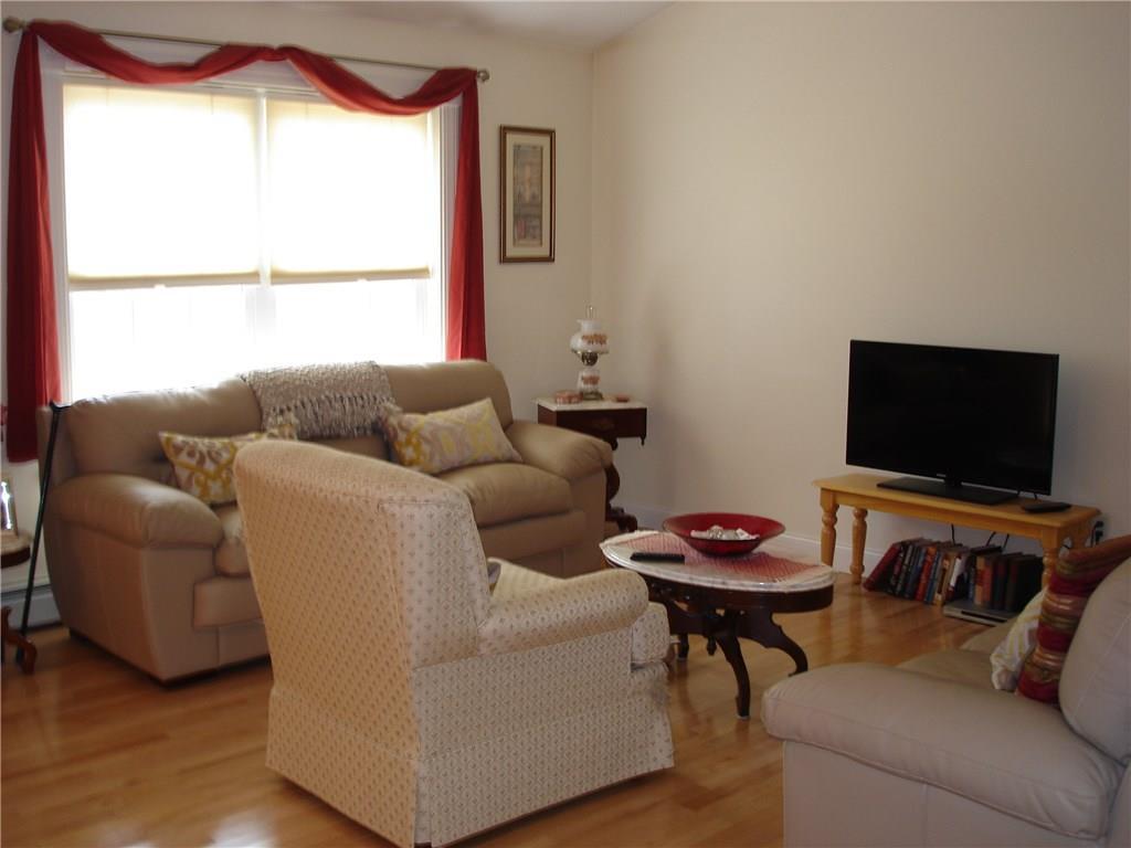 27 Highland Ridge Drive, Unit 27 Hampden, ME 04444 - Photo 11 of 32 Open Living Room Area!