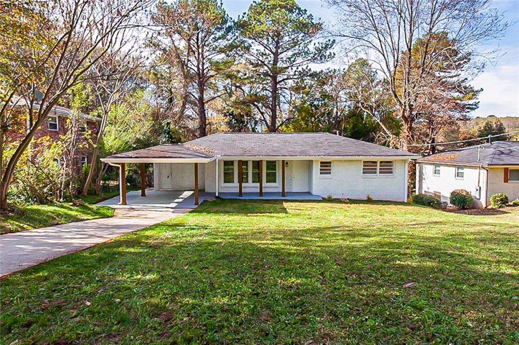 2311 Belmont Drive Decatur, GA 30032 - Photo 1 of 1 a front view of a house with a garden