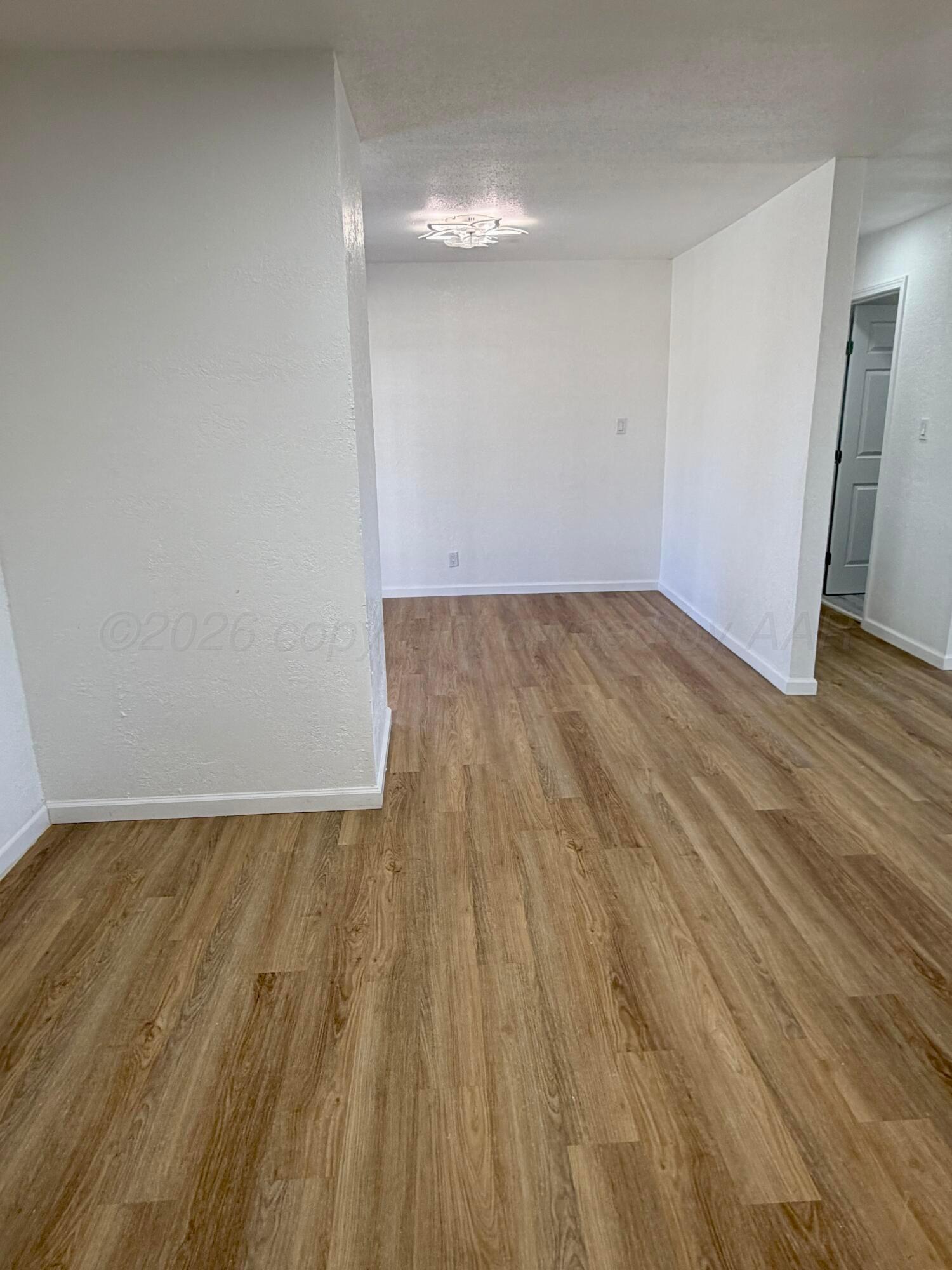 104 Warwick Street Borger, TX 79007 - Photo 15 of 28 wooden floor in a room