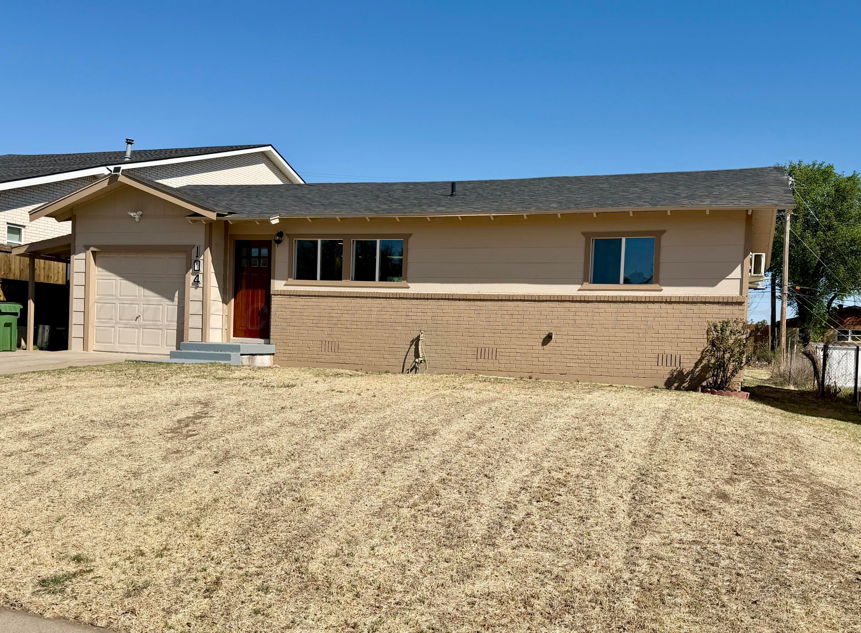 104 Warwick Street Borger, TX 79007 - Photo 2 of 28 a front view of a house with a yard