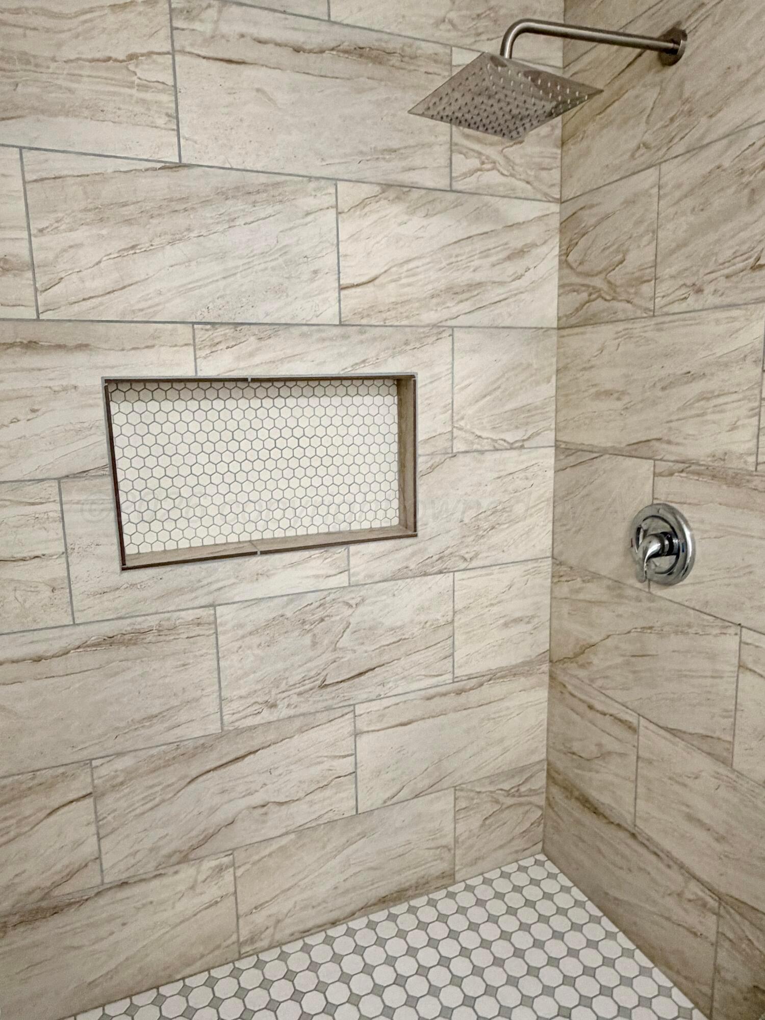 104 Warwick Street Borger, TX 79007 - Photo 21 of 28 a bathroom with a shower
