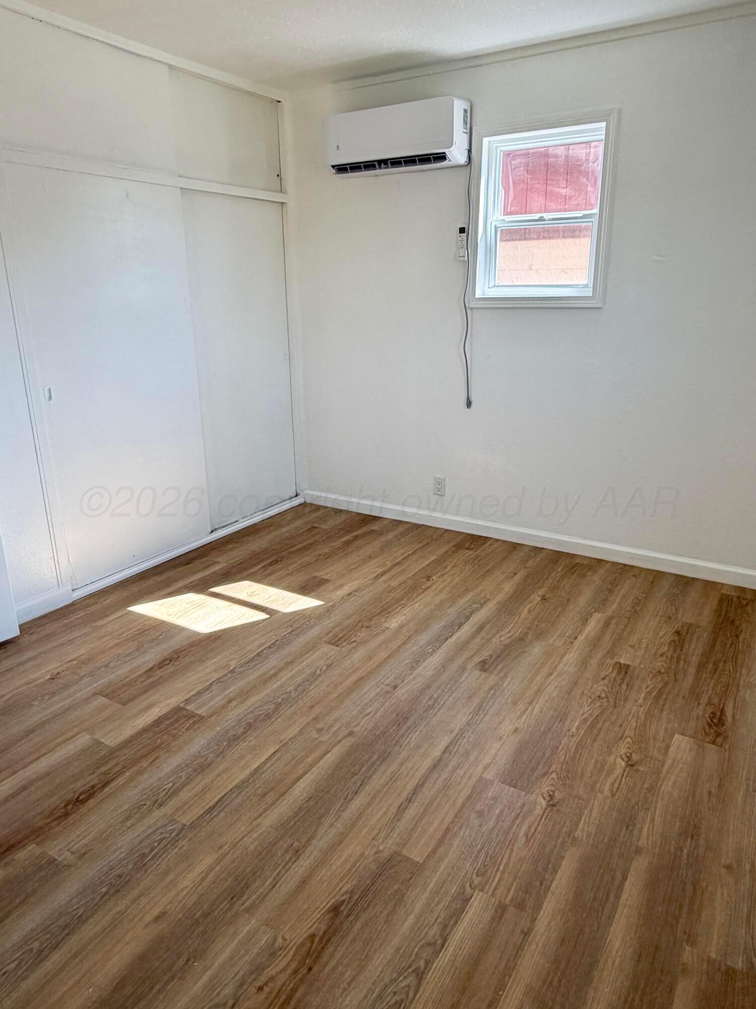 104 Warwick Street Borger, TX 79007 - Photo 23 of 28 a view of empty room with wooden floor