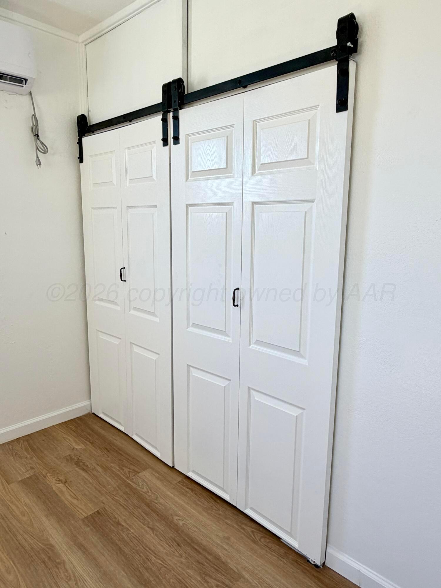 104 Warwick Street Borger, TX 79007 - Photo 25 of 28 a view of a room with wooden floor
