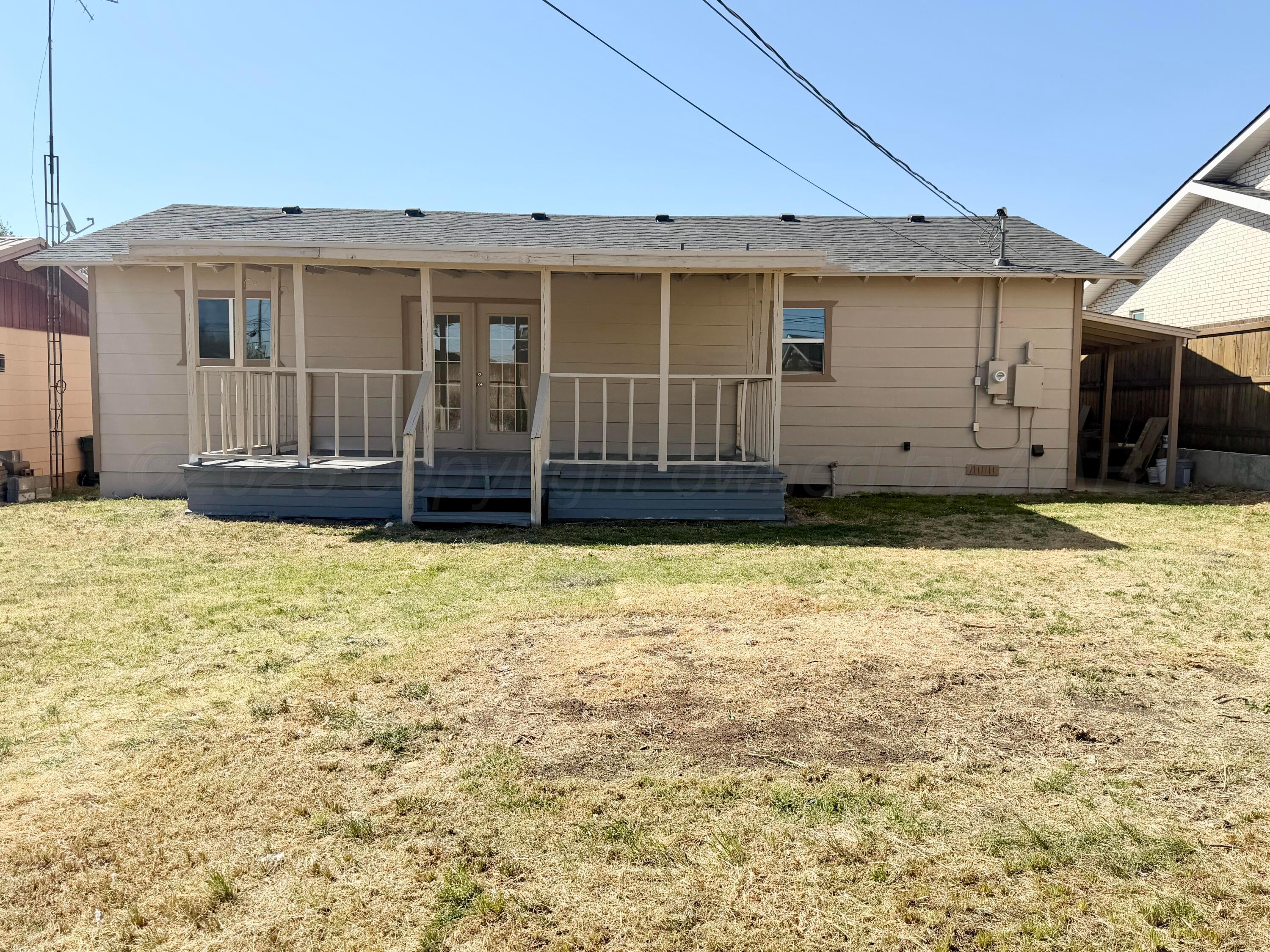 104 Warwick Street Borger, TX 79007 - Photo 27 of 28 a view of a house with wooden floor and a yard