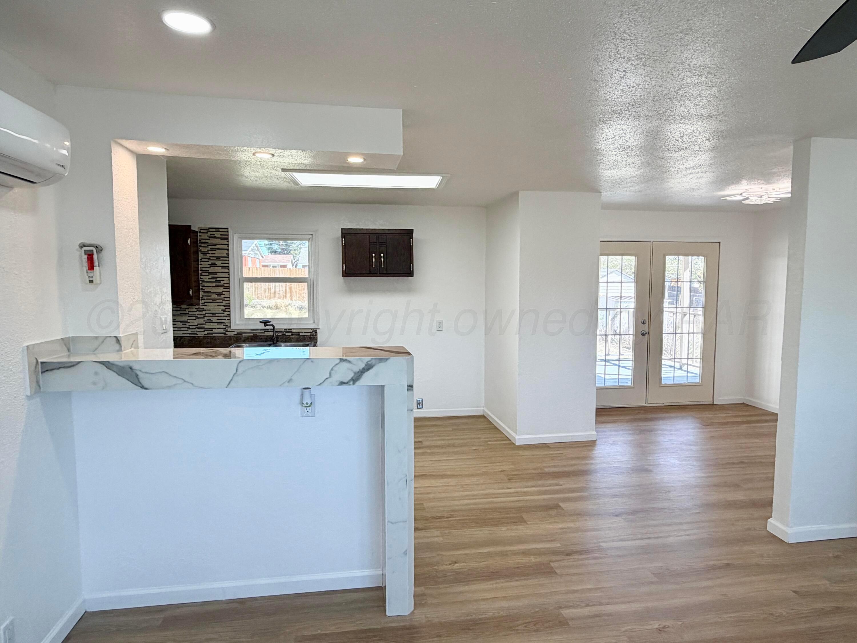 104 Warwick Street Borger, TX 79007 - Photo 7 of 28 a living room with furniture and a flat screen tv
