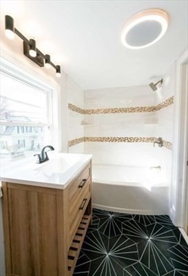 35 Wright Street Stoneham, MA 02180 - Photo 14 of 19 a bathroom with a sink and a mirror