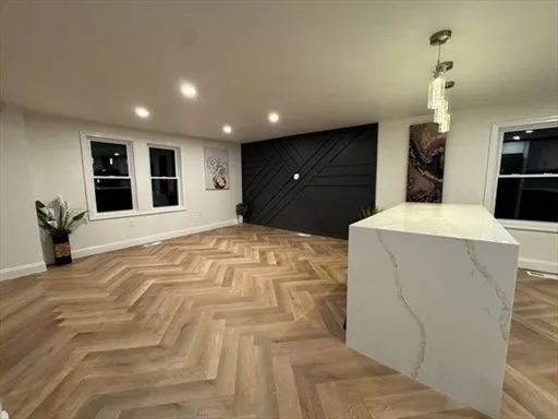 a large bedroom with a large bed and a large mirror
