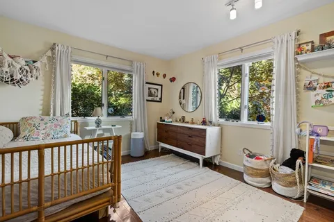 a view of a room with gym equipment and windows