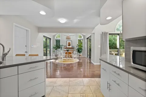 a kitchen with sink and cabinets
