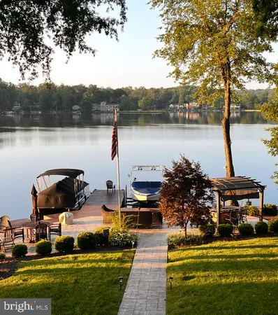 an aerial view of a house with outdoor space