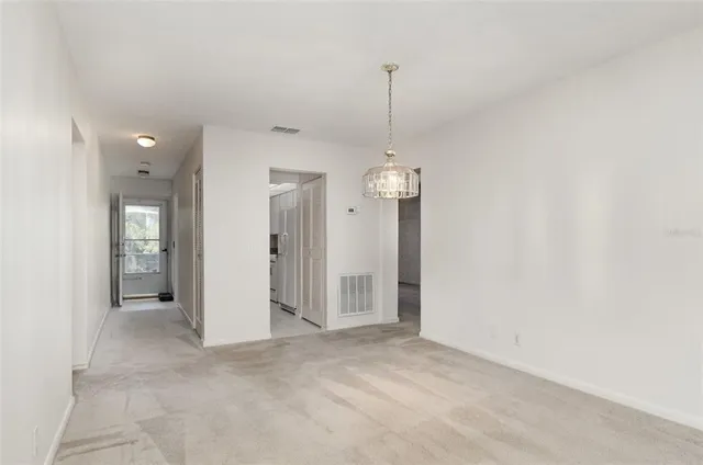 a view of empty room with a ceiling fan