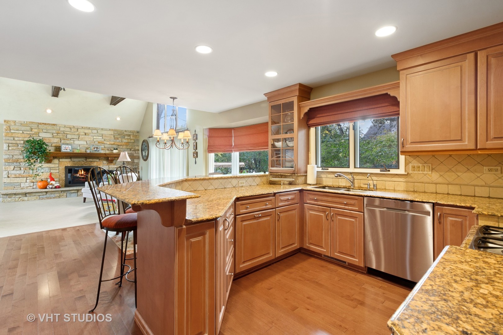 985 Chapel Court North Glen Ellyn, IL 60137 - Photo 11 of 39 a kitchen with stainless steel appliances granite countertop sink microwave and wooden cabinets