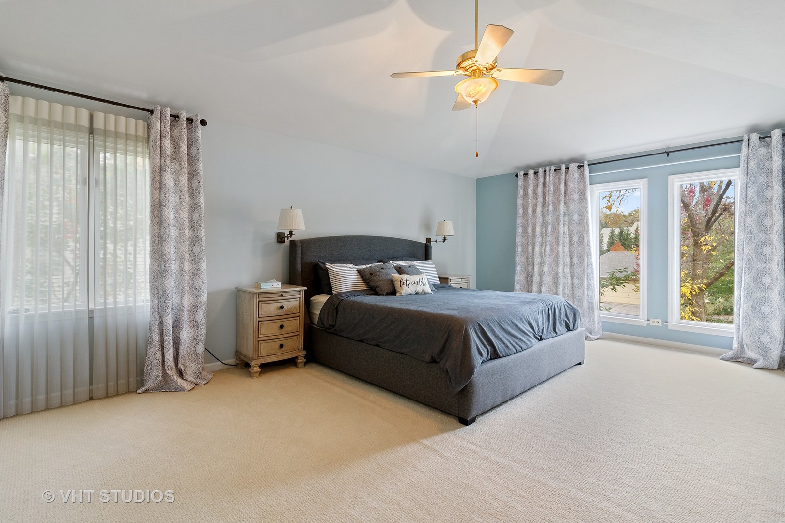 985 Chapel Court North Glen Ellyn, IL 60137 - Photo 15 of 39 a bedroom with a large bed and a chandelier