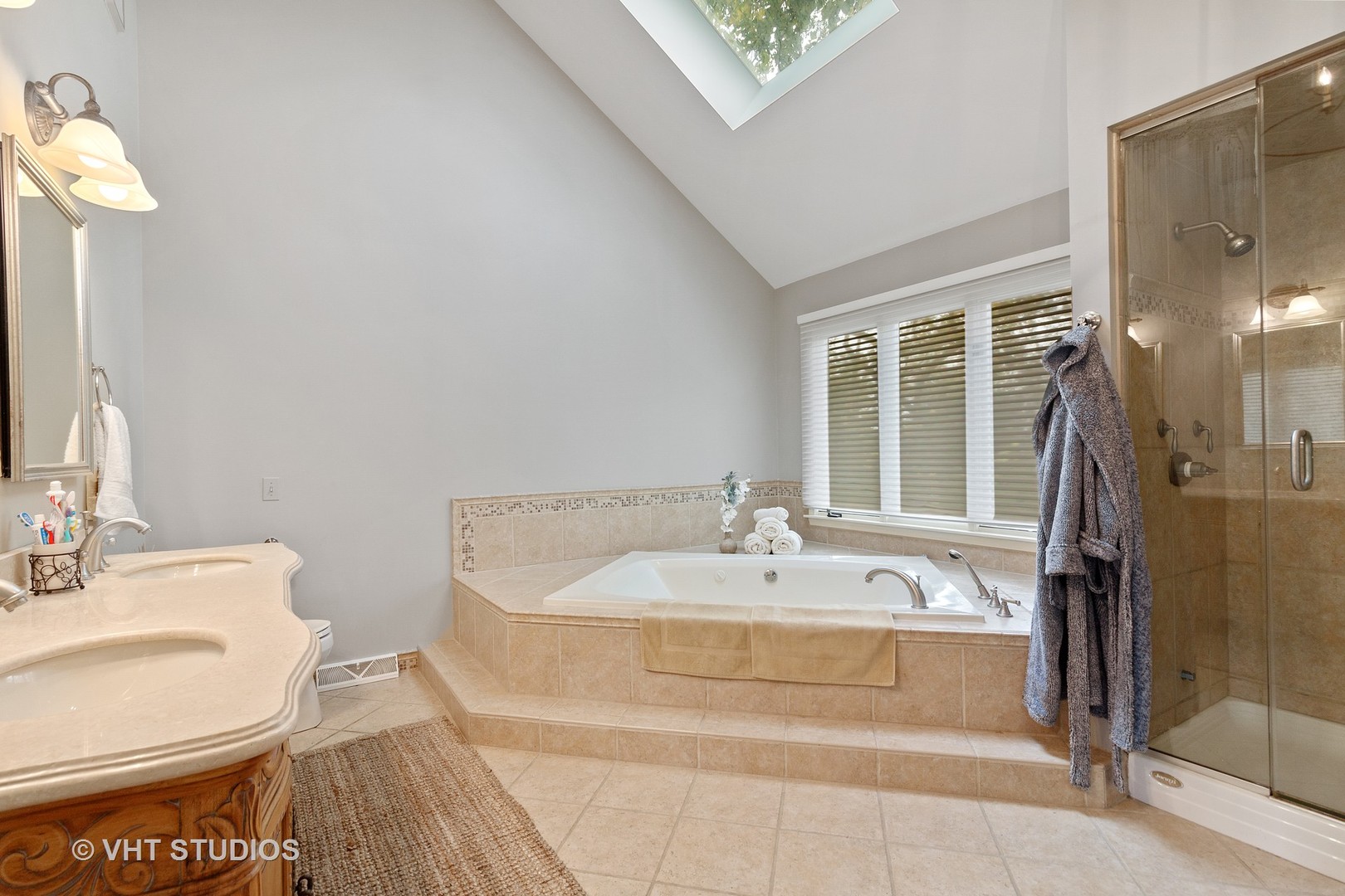 985 Chapel Court North Glen Ellyn, IL 60137 - Photo 16 of 39 a bathroom with a sink and a mirror
