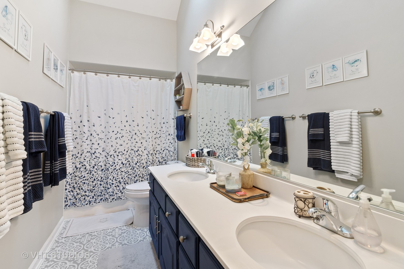 985 Chapel Court North Glen Ellyn, IL 60137 - Photo 21 of 39 a bathroom with a double vanity sink toilet and shower
