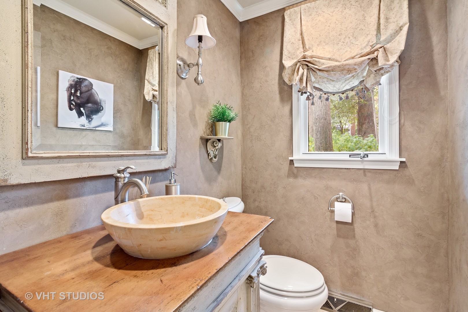 985 Chapel Court North Glen Ellyn, IL 60137 - Photo 25 of 39 a bathroom with a toilet a sink and a mirror