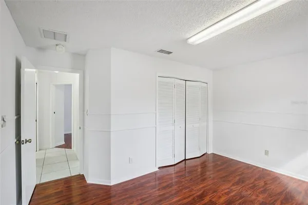 a view of hallway with wooden floor