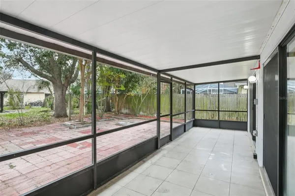 a view of a room with porch and wooden floor