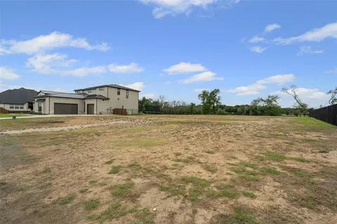 a view of a large body of water with a building in the background