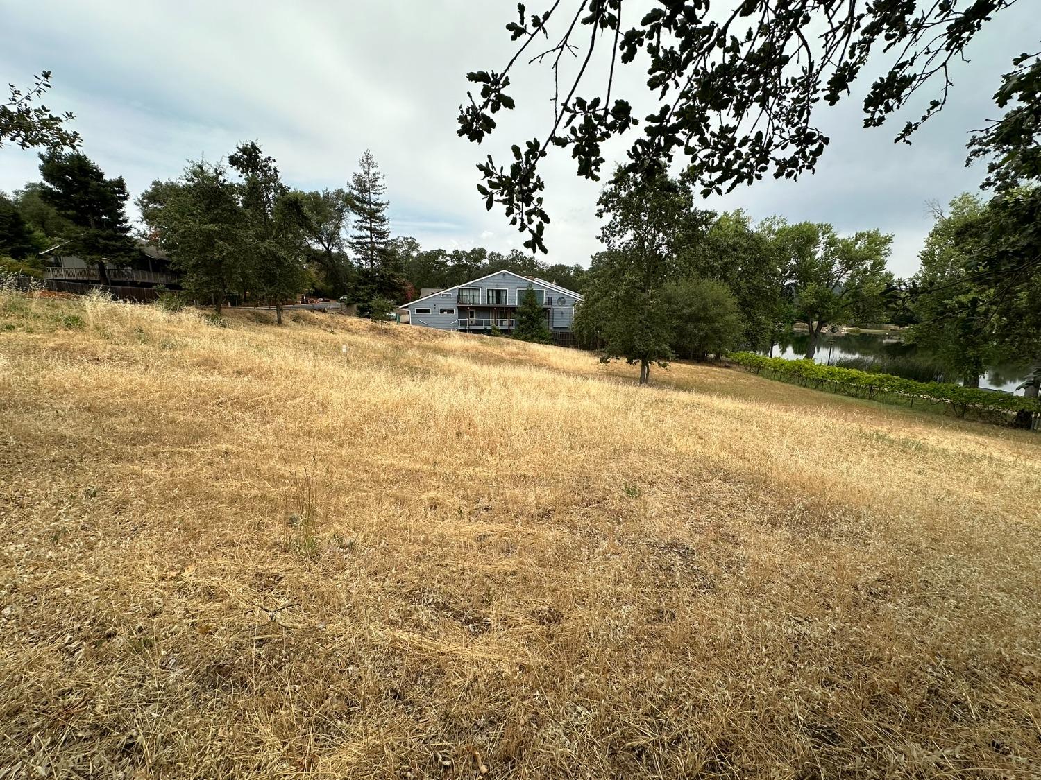 3053 Cambridge Road Cameron Park, CA 95682 - Photo 14 of 22 a view of a yard with a house