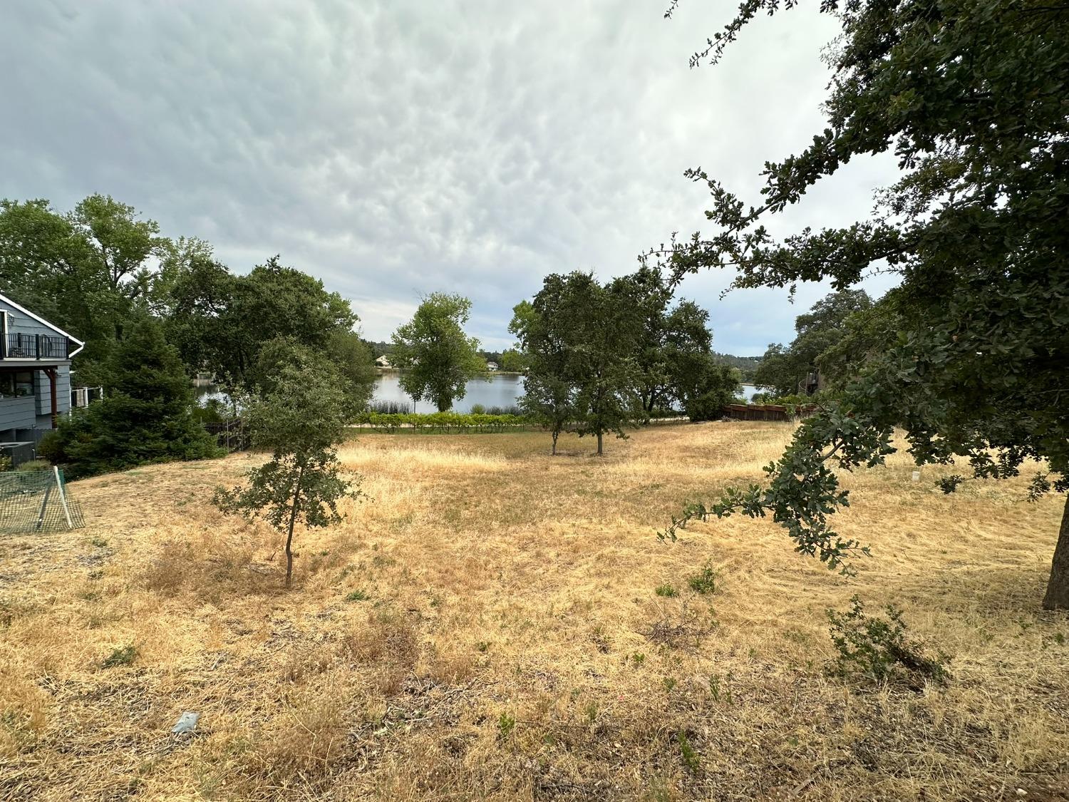 3053 Cambridge Road Cameron Park, CA 95682 - Photo 5 of 22 a view of yard covered with snow in front of house