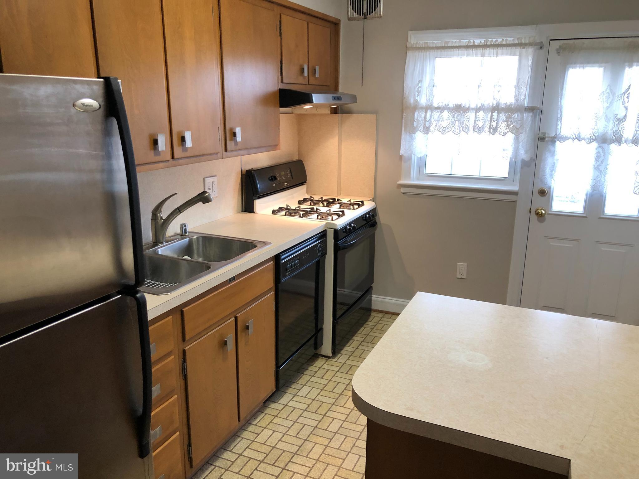 3717 Delverne Road Baltimore, MD 21218 - Photo 6 of 26 Extra cabinets & counter space in updated kitchen