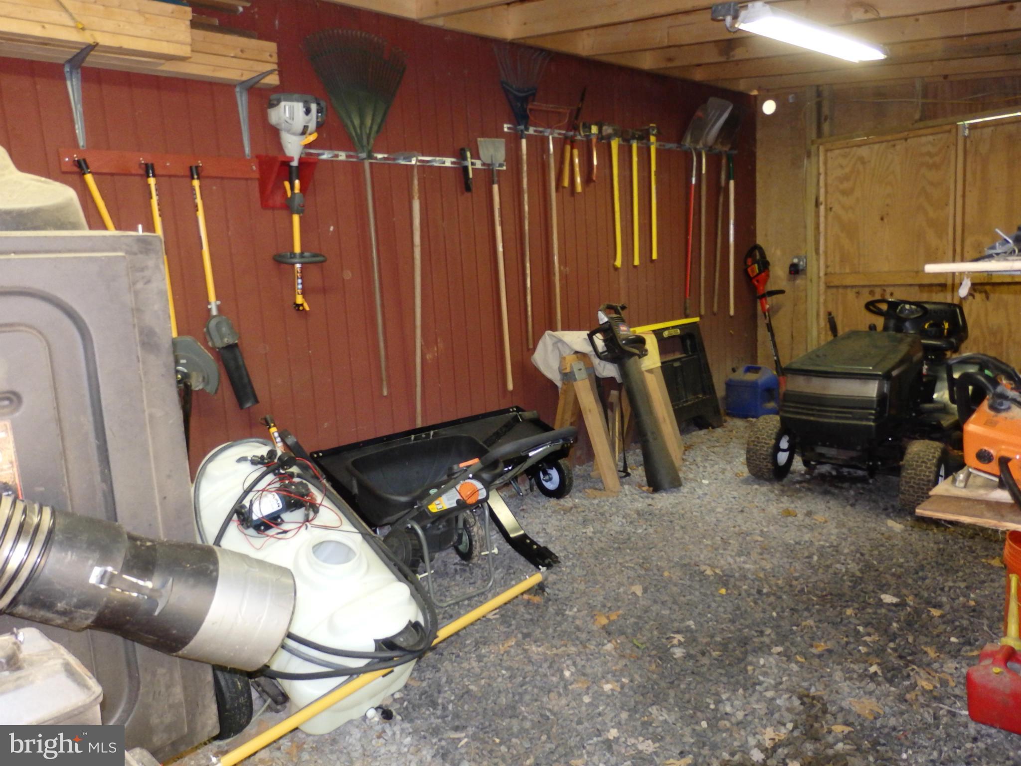 9212 Bethel Road Frederick, MD 21702 - Photo 24 of 30 Lawn equipment storage room in barn