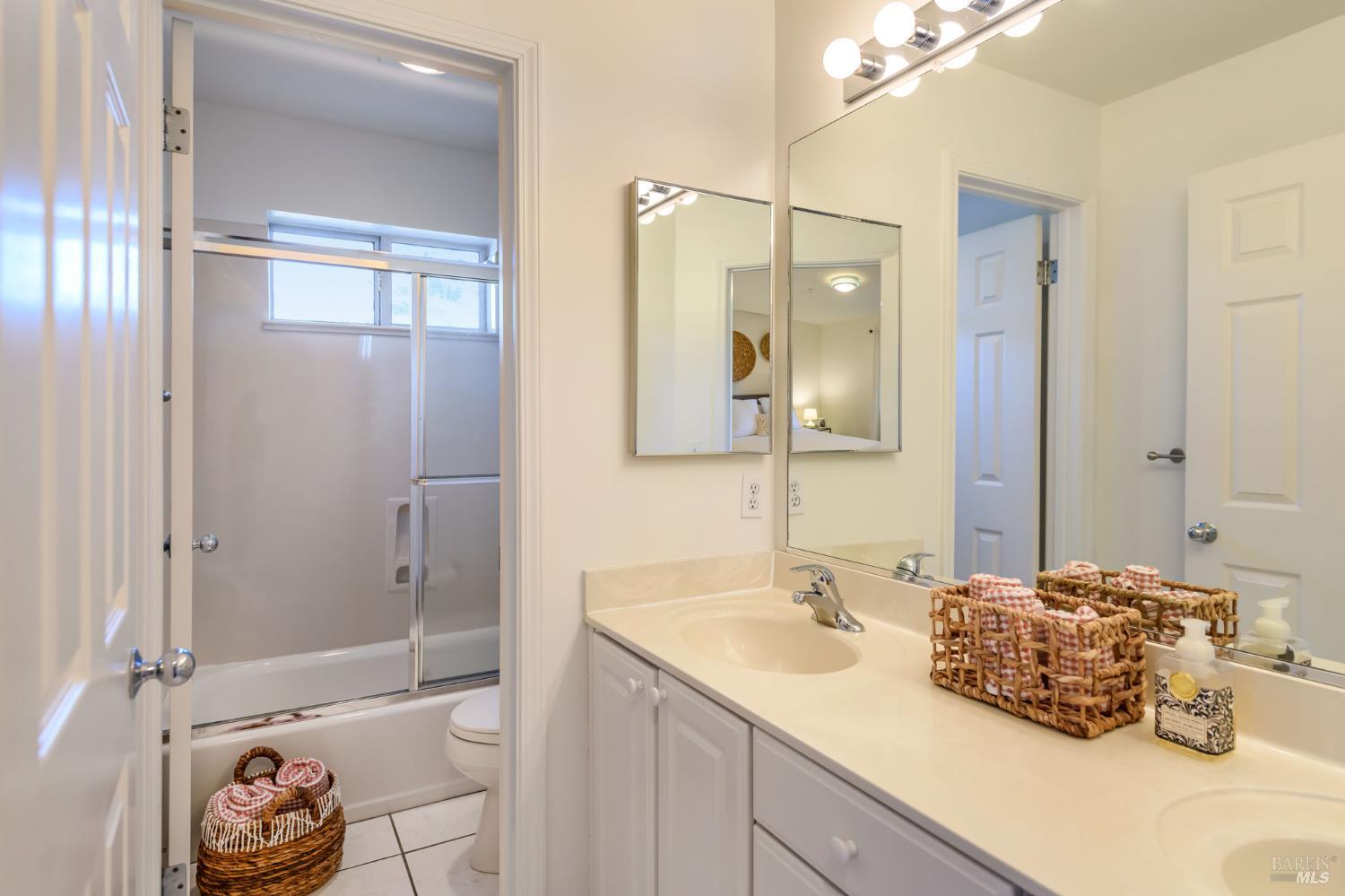 13 Laurel Glen Terrace San Rafael, CA 94903 - Photo 22 of 26 Downstairs bathroom with two sinks, Shower over tub.