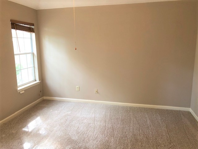 1188 Clear Creek Road Collierville, TN 38017 - Photo 4 of 6 wooden floor in an empty room with a window