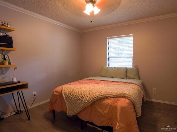 3200 Hummingbird Avenue McAllen, TX 78504 - Photo 12 of 31 a bed sitting in a bedroom next to a window