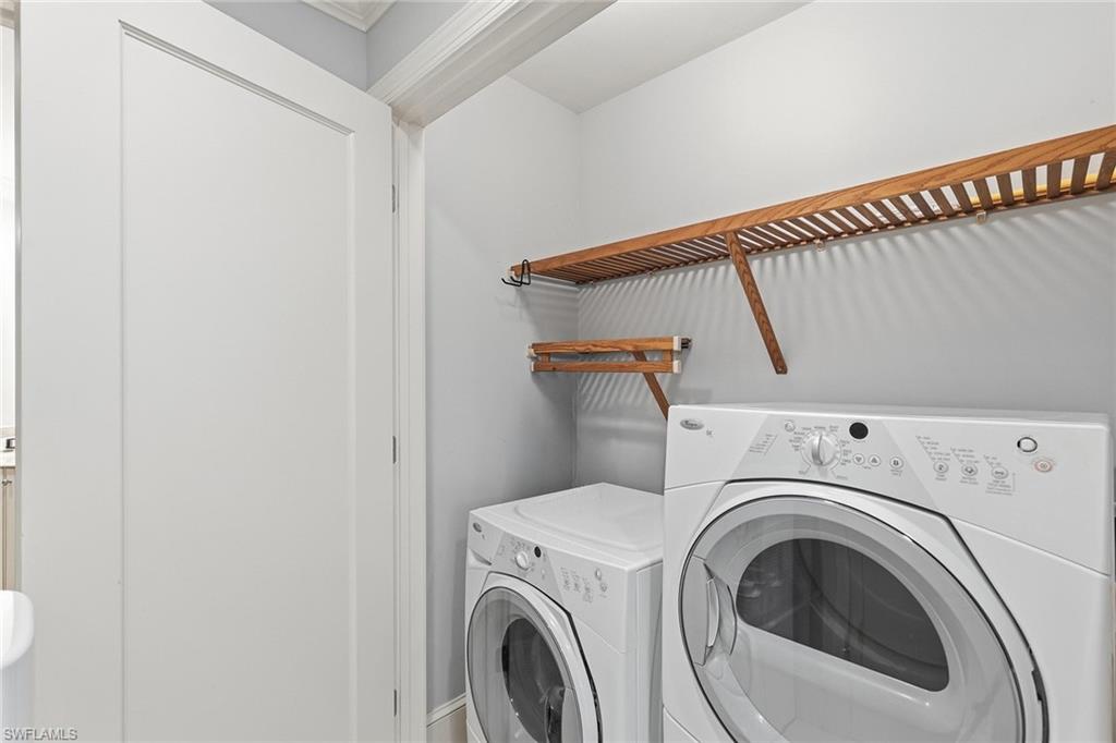 9123 Strada Place, Unit 7409 Naples, FL 34108 - Photo 16 of 34 a utility room with dryer and washer