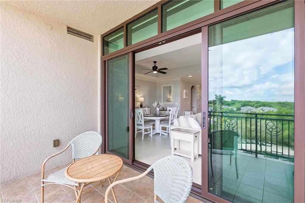 9123 Strada Place, Unit 7409 Naples, FL 34108 - Photo 17 of 34 a view of a dining room with furniture window and outside view