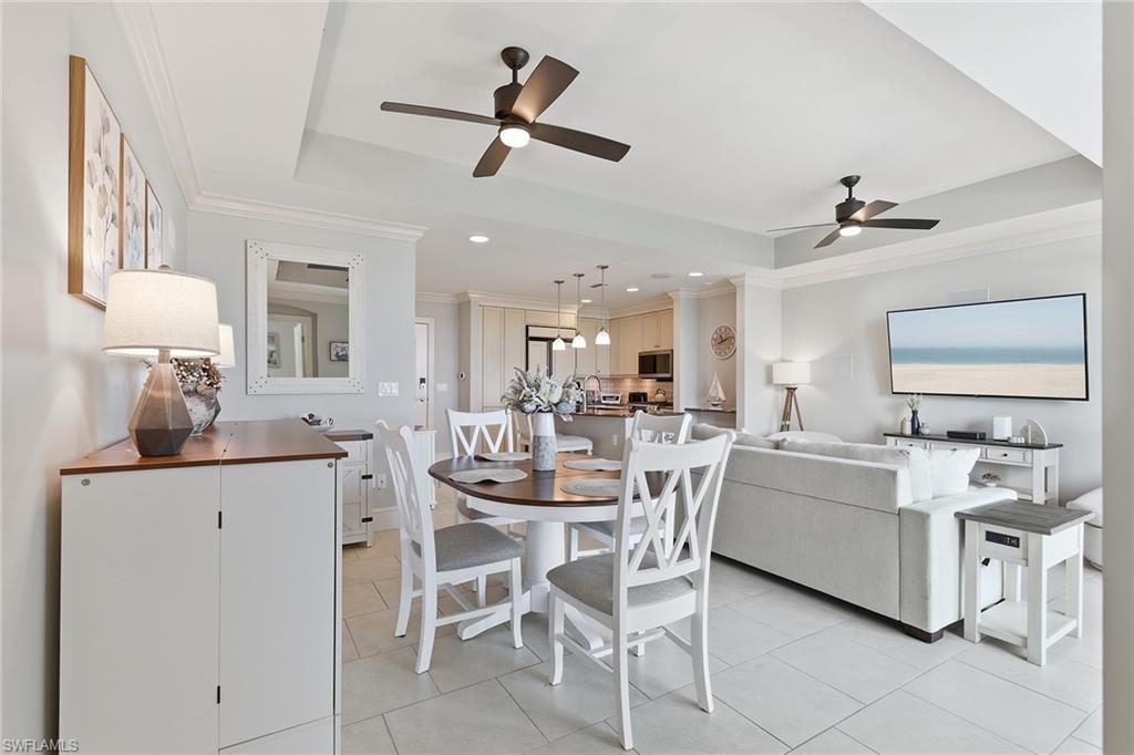 9123 Strada Place, Unit 7409 Naples, FL 34108 - Photo 3 of 34 a dining room with furniture and window