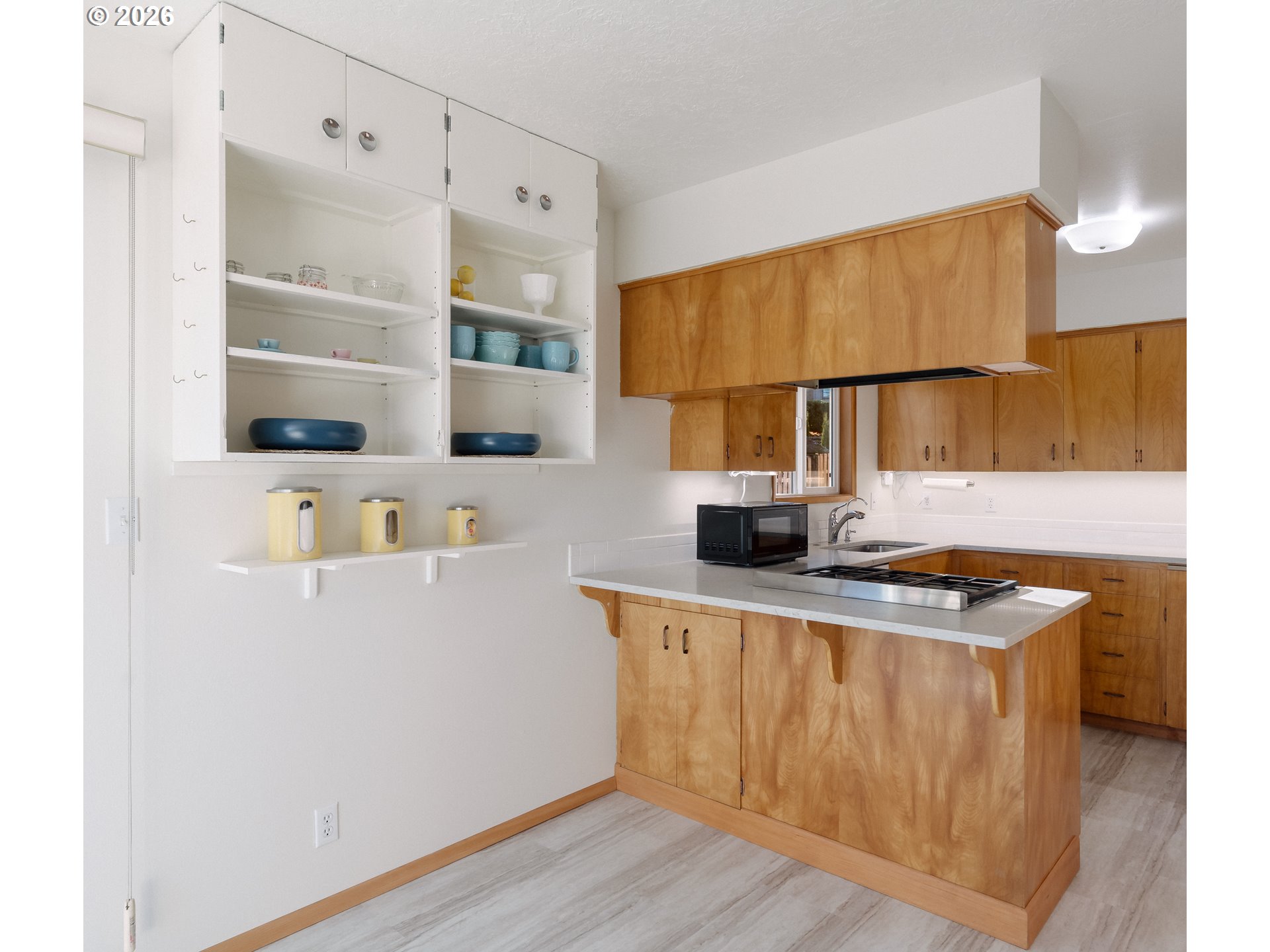 14285 Southwest 114th Avenue Tigard, OR 97224 - Photo 16 of 42 a kitchen with stainless steel appliances granite countertop a sink a stove and a refrigerator