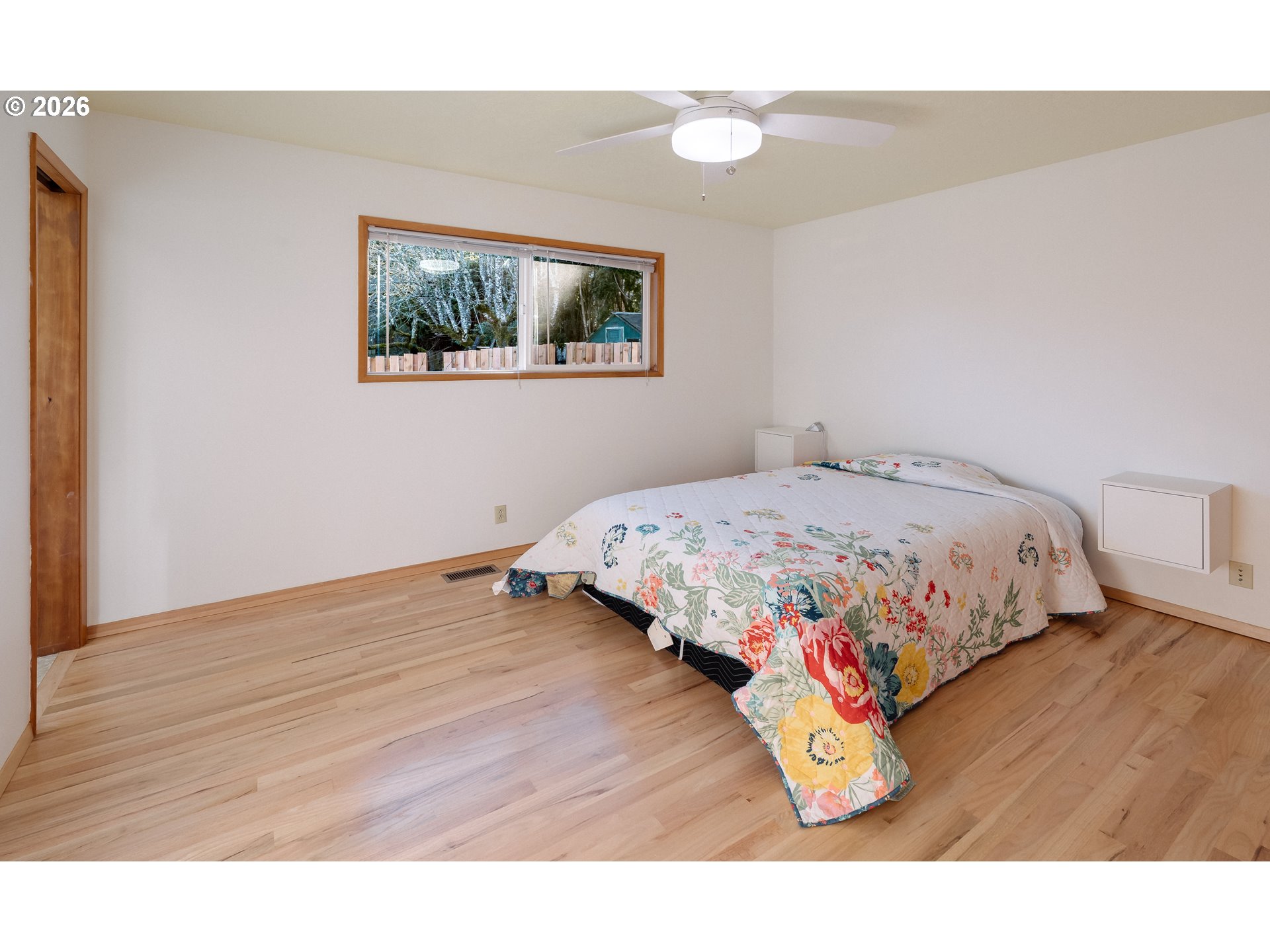 14285 Southwest 114th Avenue Tigard, OR 97224 - Photo 17 of 42 a bedroom with a bed and a night stand