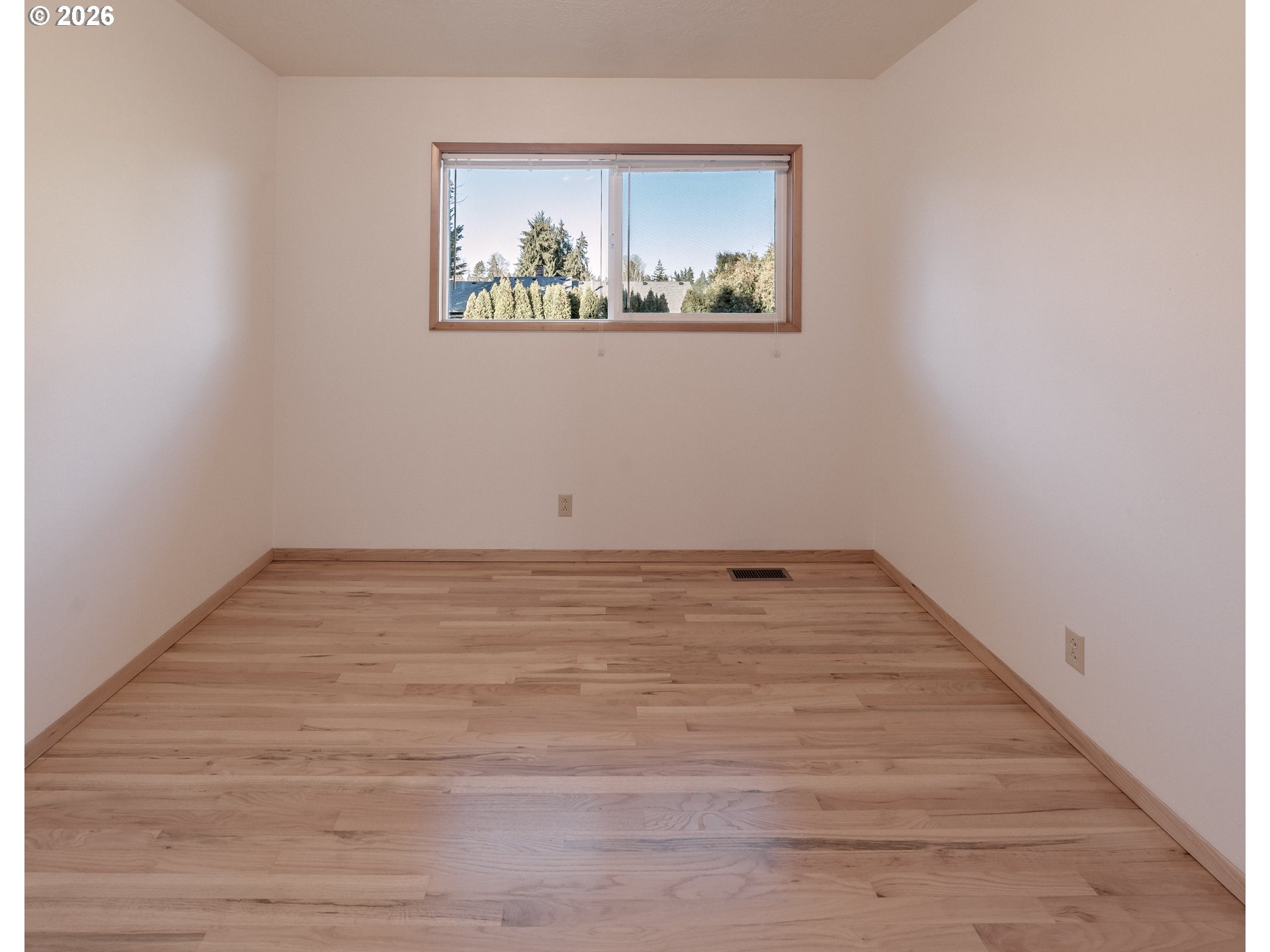 14285 Southwest 114th Avenue Tigard, OR 97224 - Photo 21 of 42 a view of a room with wooden floor